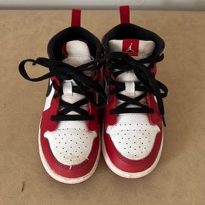 Red white and black Nike Jordan’s